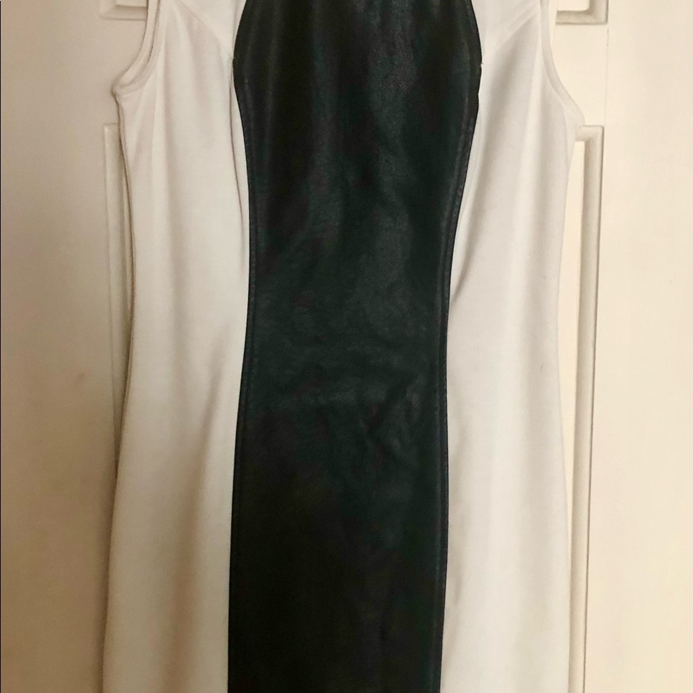 Hip faux black leather/white dress. Worn twice.  Fits true to size